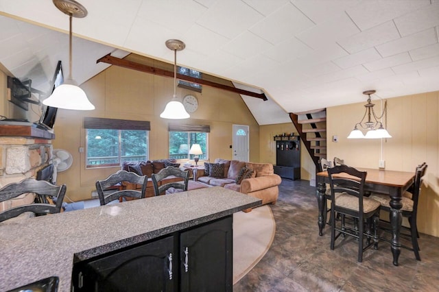 173 Pontiac Path, Pocono Lake, PA 18347 - kitchen with decorative light fixtures, open floor plan, and dark cabinetry