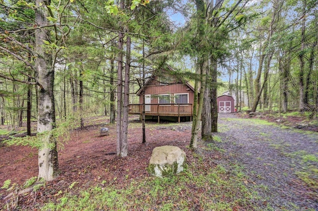 173 Pontiac Path, Pocono Lake, PA 18347 - view of yard featuring a storage shed and a wooden deck