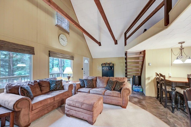 173 Pontiac Path, Pocono Lake, PA 18347 - living area featuring beam ceiling, high vaulted ceiling, and wooden walls
