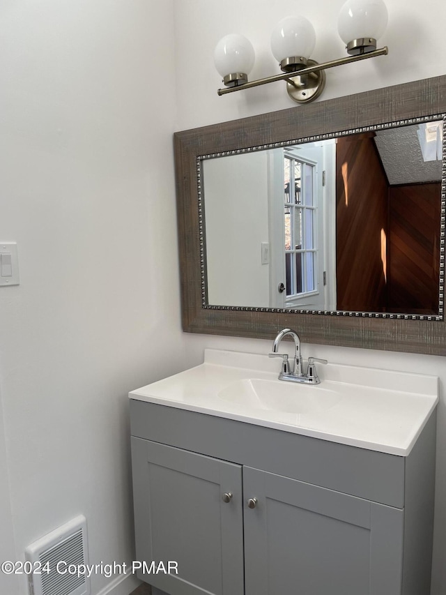 bathroom featuring visible vents and vanity