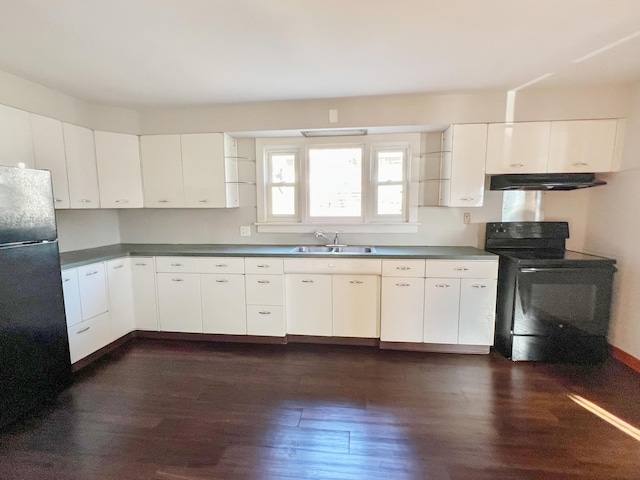 kitchen featuring white cabinets, dark wood finished floors, under cabinet range hood, black appliances, and a sink