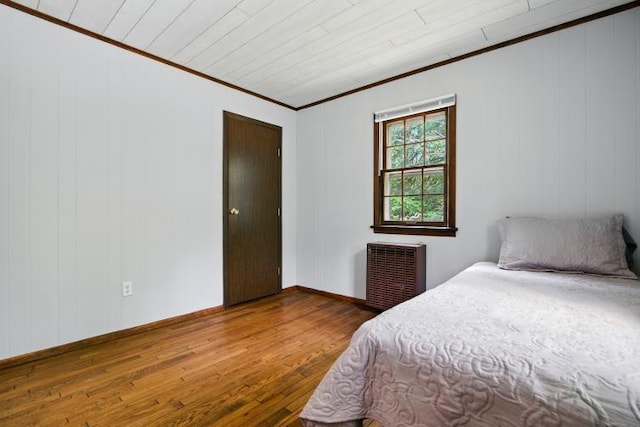 1042 Middleridge Dr, Gouldsboro, PA 18424 - bedroom featuring crown molding, wood finished floors, and radiator
