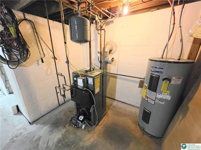 utility room featuring electric water heater and a heating unit