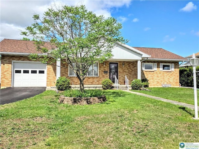 ranch-style house with an attached garage, asphalt driveway, brick siding, and a front yard