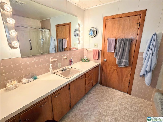 bathroom with ornamental molding, tile walls, vanity, and a shower with shower curtain