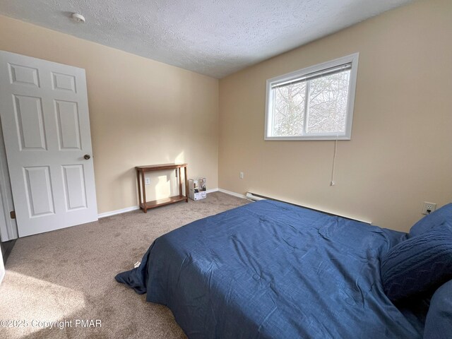 carpeted bedroom featuring a textured ceiling