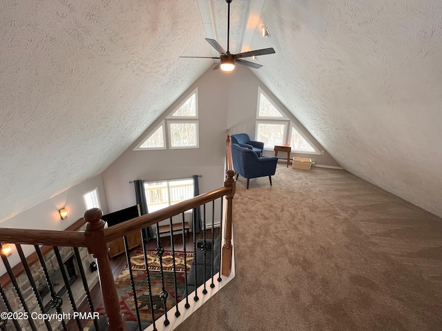 bonus room featuring vaulted ceiling, a textured ceiling, and carpet