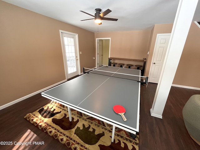 recreation room featuring dark wood-type flooring and ceiling fan