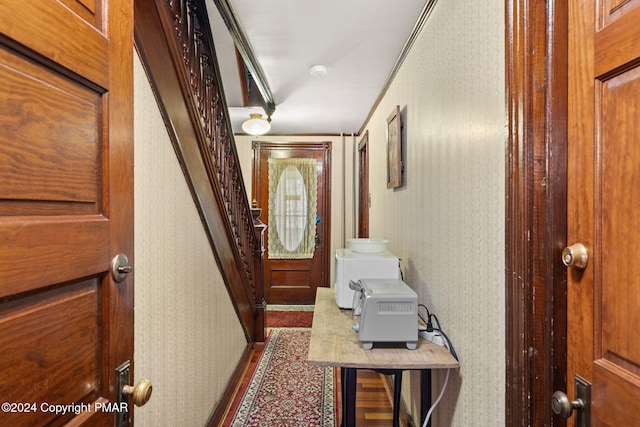 corridor with wallpapered walls and stairway