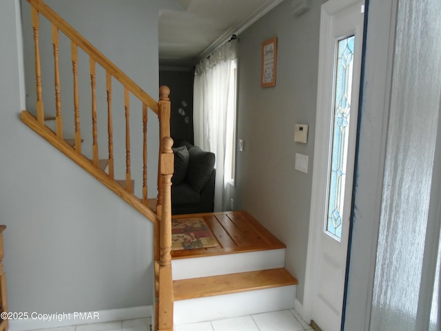 foyer entrance with light tile patterned floors