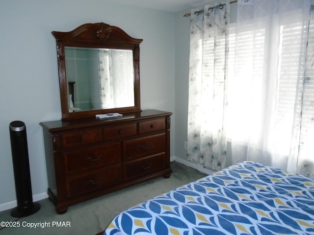 bedroom with light colored carpet