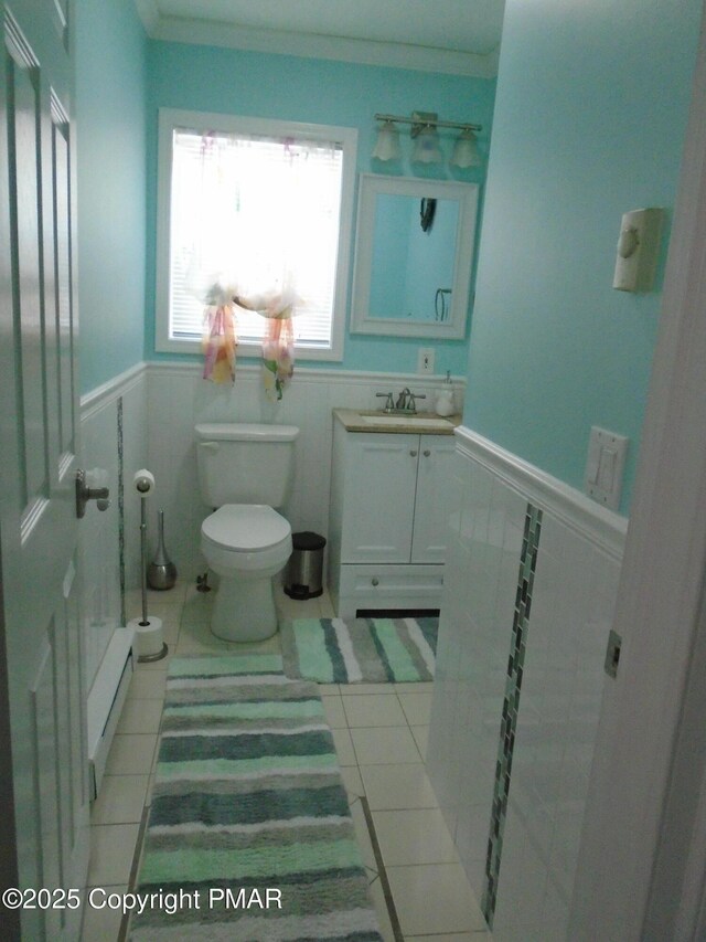 bathroom featuring crown molding, tile patterned floors, toilet, and vanity