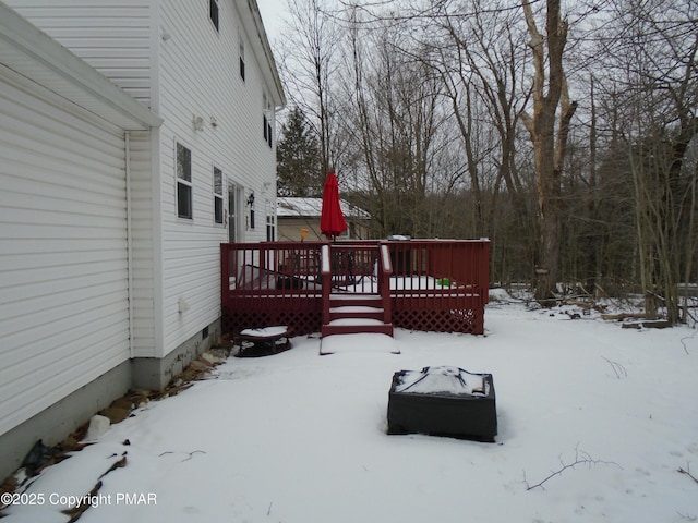 view of snow covered deck