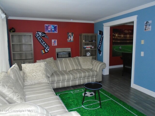 living room with crown molding, wood-type flooring, and heating unit