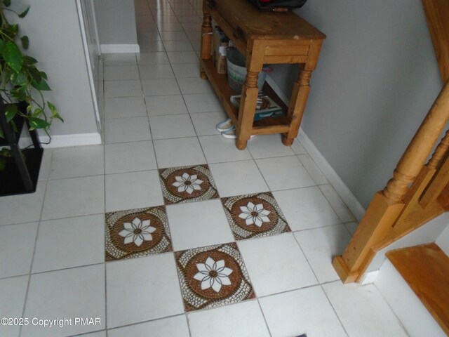 hall with light tile patterned flooring