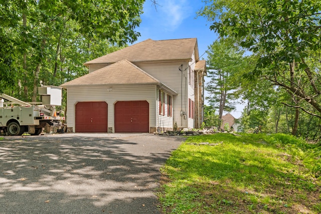 60 Arbutus Ln, East Stroudsburg, PA 18302 - view of home's exterior with a garage and driveway