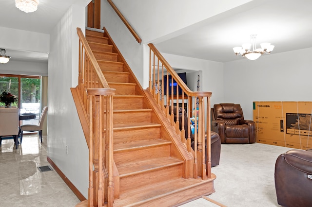 60 Arbutus Ln, East Stroudsburg, PA 18302 - stairway with a chandelier