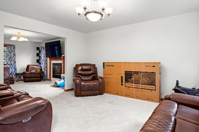 60 Arbutus Ln, East Stroudsburg, PA 18302 - carpeted living room featuring a chandelier and a high end fireplace