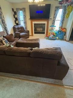 60 Arbutus Ln, East Stroudsburg, PA 18302 - carpeted living area featuring a fireplace and plenty of natural light
