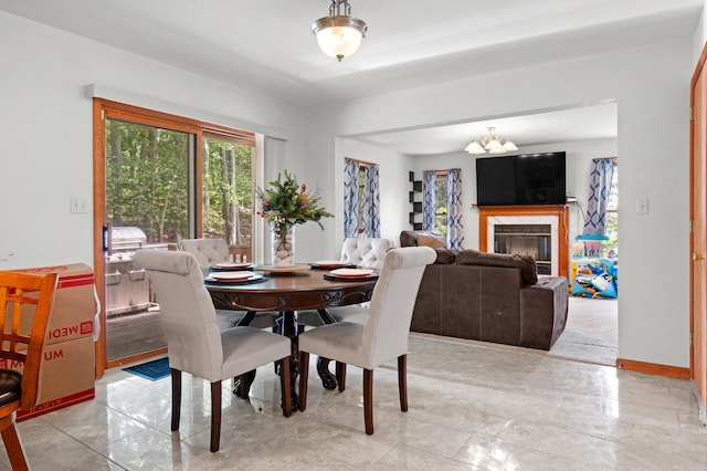 60 Arbutus Ln, East Stroudsburg, PA 18302 - dining room with a chandelier and a glass covered fireplace