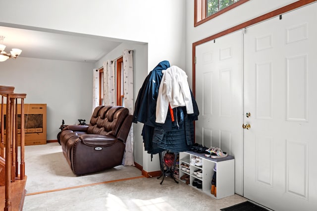60 Arbutus Ln, East Stroudsburg, PA 18302 - carpeted foyer with baseboards and a chandelier