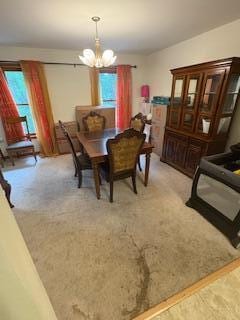 60 Arbutus Ln, East Stroudsburg, PA 18302 - dining space featuring a chandelier and light carpet
