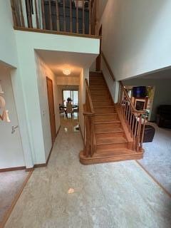 60 Arbutus Ln, East Stroudsburg, PA 18302 - staircase featuring a high ceiling