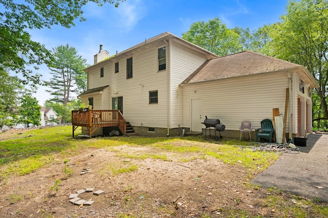 60 Arbutus Ln, East Stroudsburg, PA 18302 - rear view of property with a deck and a chimney