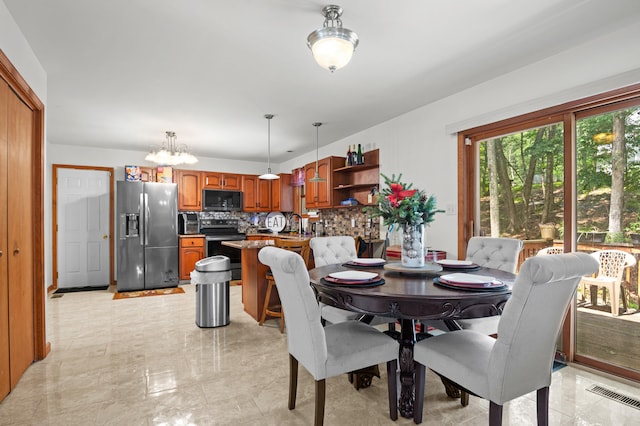 60 Arbutus Ln, East Stroudsburg, PA 18302 - dining area featuring a chandelier