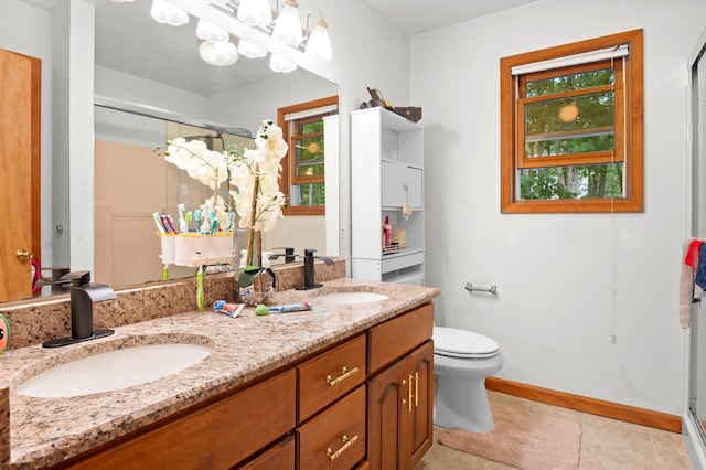 60 Arbutus Ln, East Stroudsburg, PA 18302 - full bathroom with a shower stall, double vanity, and healthy amount of natural light