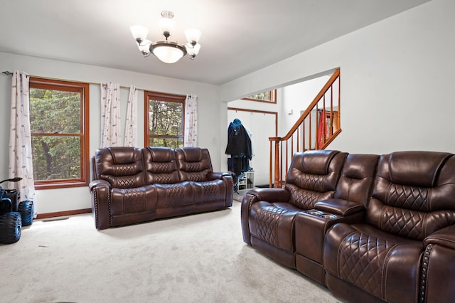 60 Arbutus Ln, East Stroudsburg, PA 18302 - living room with a chandelier, carpet floors, stairway, and plenty of natural light