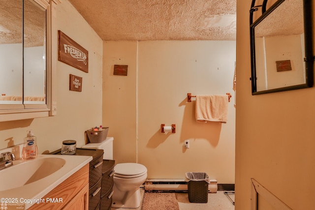 3310 Hazen Ave, Roseto, PA 18013 - bathroom with toilet, a textured ceiling, baseboard heating, and vanity