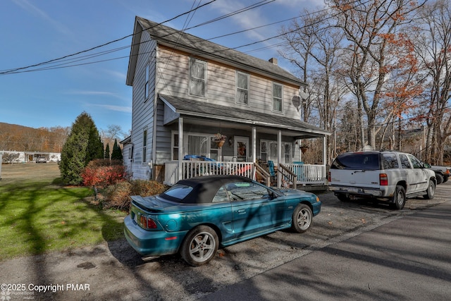 3310 Hazen Ave, Roseto, PA 18013 - view of front of property with a chimney, a front lawn, and a porch