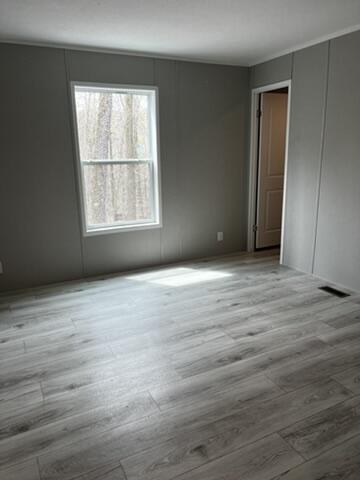 132 Spruce St, Greentown, PA 18426 - unfurnished room with wood finished floors and a decorative wall