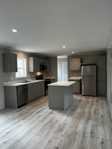 132 Spruce St, Greentown, PA 18426 - kitchen featuring freestanding refrigerator, electric range oven, black dishwasher, light wood-type flooring, and light countertops