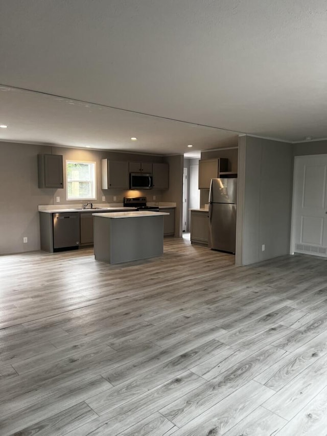 132 Spruce St, Greentown, PA 18426 - kitchen with appliances with stainless steel finishes, light wood finished floors, a center island, open floor plan, and recessed lighting