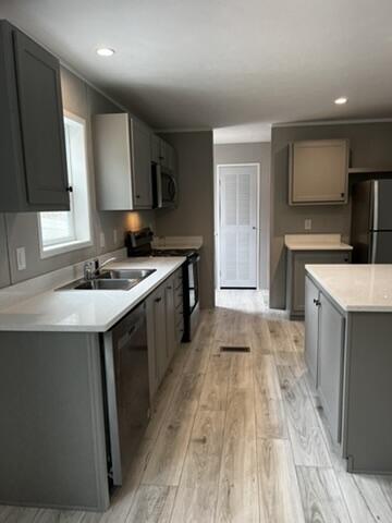 132 Spruce St, Greentown, PA 18426 - kitchen featuring black appliances, a sink, gray cabinetry, light wood-style floors, and recessed lighting