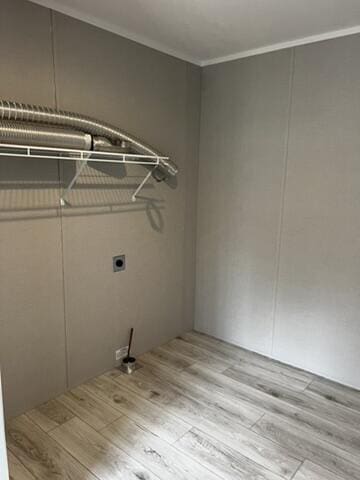 132 Spruce St, Greentown, PA 18426 - laundry area with wood finished floors, crown molding, and electric dryer hookup