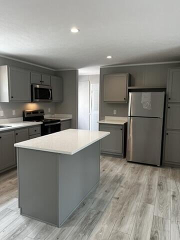 132 Spruce St, Greentown, PA 18426 - kitchen with appliances with stainless steel finishes, gray cabinetry, recessed lighting, light countertops, and light wood finished floors