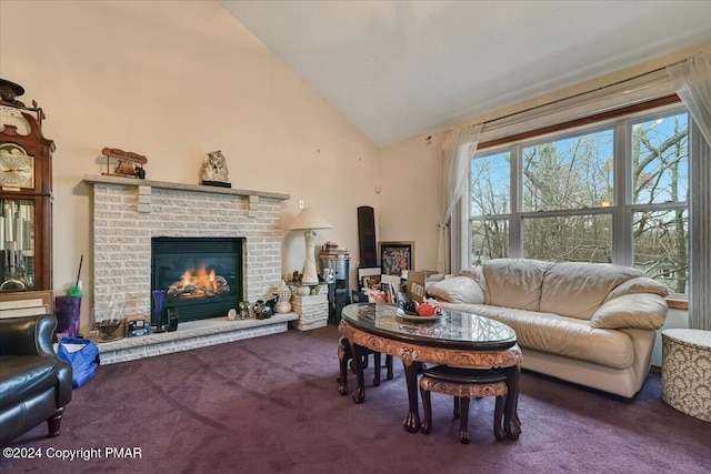 carpeted living area featuring a fireplace and high vaulted ceiling