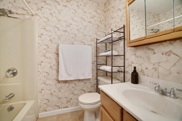 bathroom featuring vanity, baseboards, shower / tub combination, tile patterned floors, and toilet