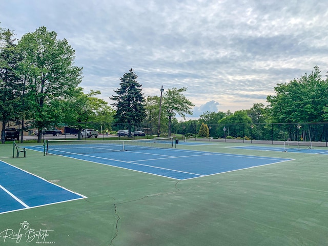 view of sport court featuring community basketball court and fence