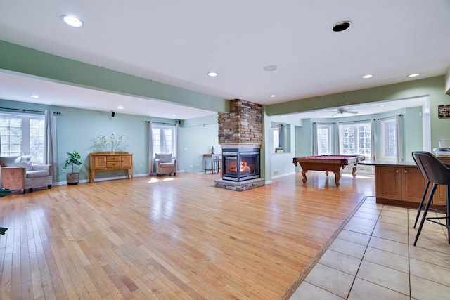 living room featuring billiards, light wood-style flooring, recessed lighting, and baseboards