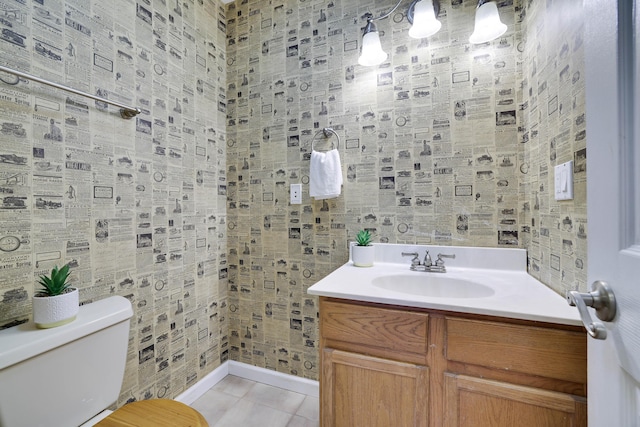 bathroom with vanity, toilet, and tile patterned flooring
