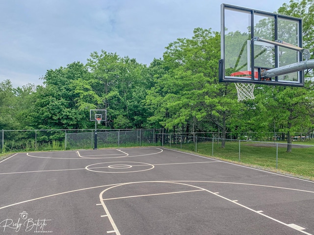 view of sport court with community basketball court and fence