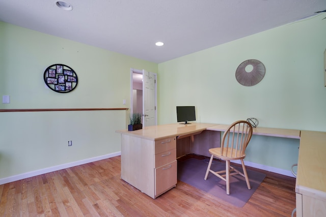 office featuring recessed lighting, baseboards, and light wood finished floors