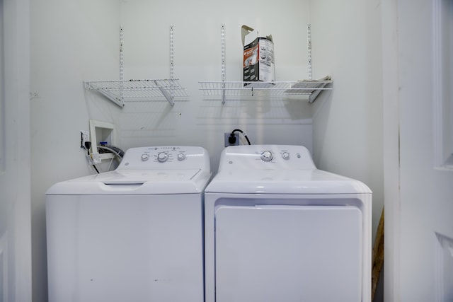 laundry area featuring independent washer and dryer and laundry area