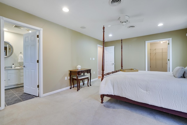 bedroom with ensuite bathroom, recessed lighting, visible vents, and carpet floors