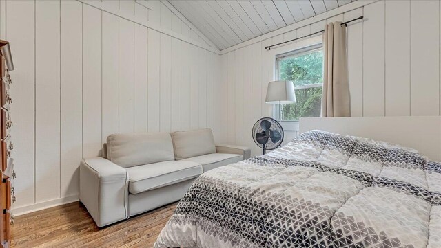 725 Clearview Dr, Long Pond, PA 18334 - bedroom featuring wood finished floors, lofted ceiling, wooden ceiling, baseboards, and wood walls