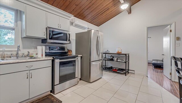 725 Clearview Dr, Long Pond, PA 18334 - kitchen with stainless steel appliances, wood ceiling, a sink, vaulted ceiling, and a wall mounted air conditioner